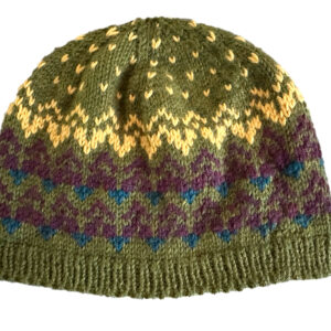Mountains and Lakes Colorwork hat in gold, purple and teal on olive green background.